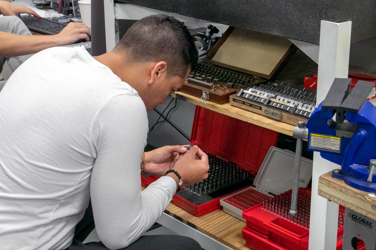 Gunsmith Looking in Tool Kit